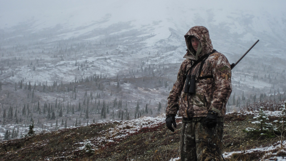 Andy with rifle in snowy landscape